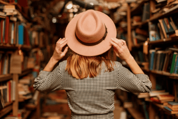 Woman standing in a bookstore, surrounded by books