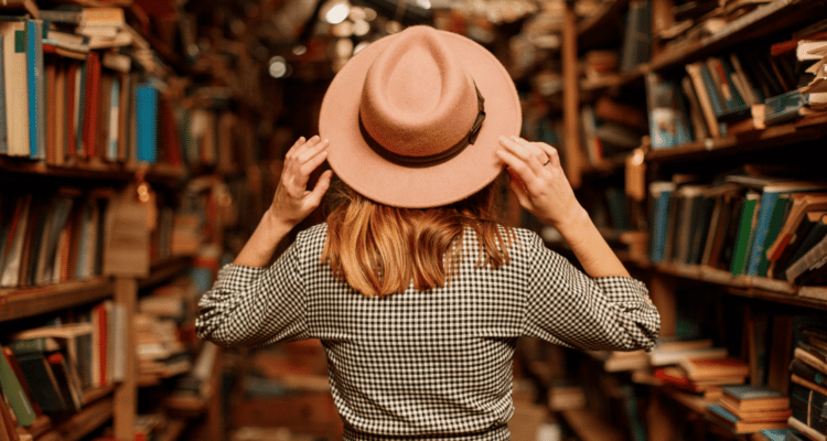 Woman standing in a bookstore, surrounded by books